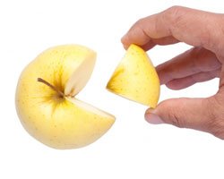 A Hand grabbing an Apple